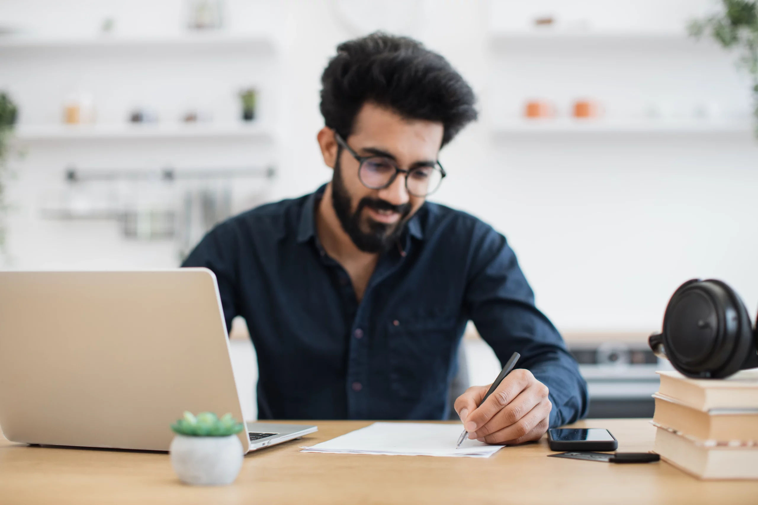 Male employee working from home on financial well-being program