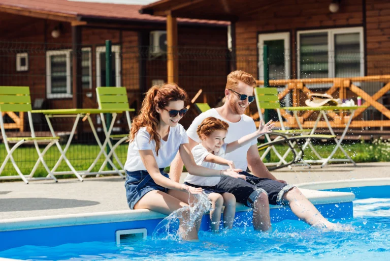 Family enjoying pool before the holiday homes Tax Changes come into effect 1/07/26