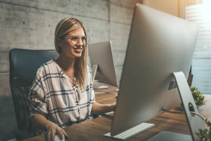 Female sole trader working on her tax.webp
