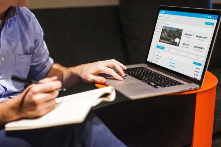 Woman sitting on ground using Investment Property Tracker software