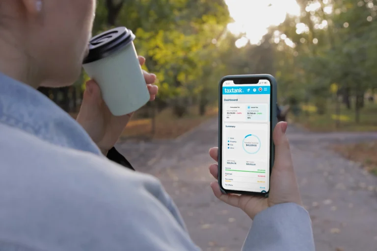 Man working on personal money management with TaxTank on their phone