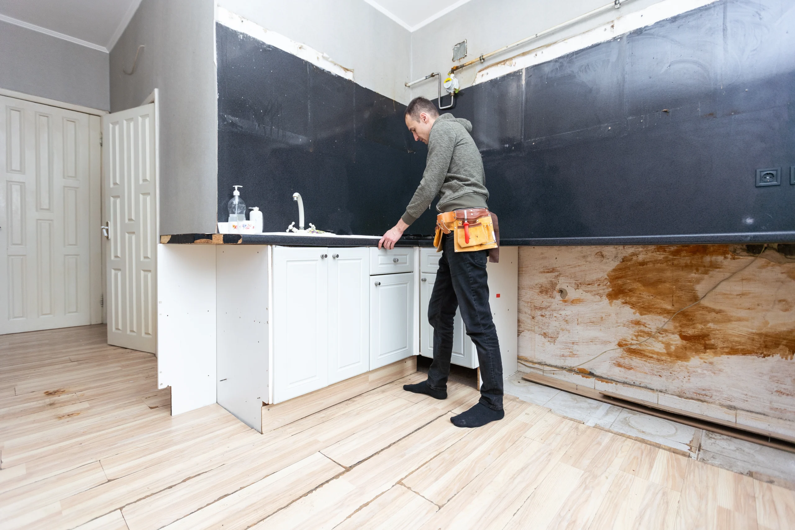 Man doing kitchen renovation for investment property depreciation