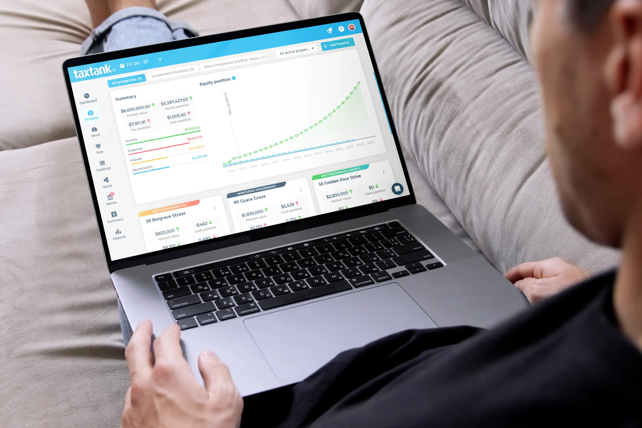 Man on laptop reviewing Australia's no1 rental property accounting software dashboard.png