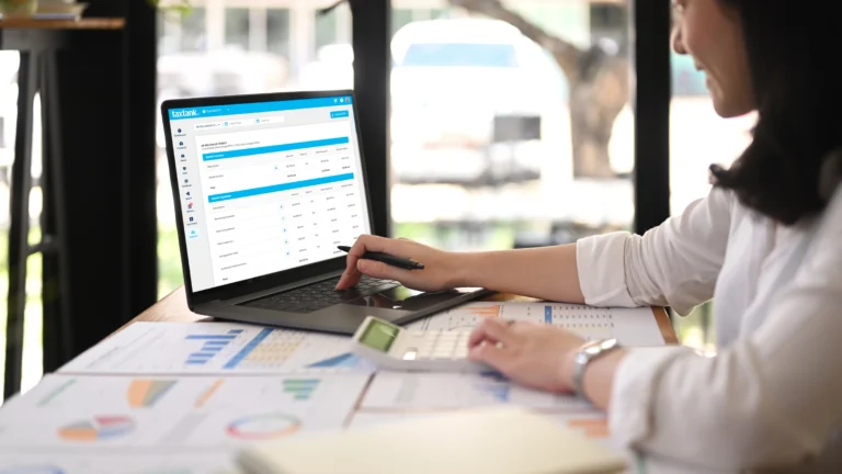 Woman on laptop using property tax software in Australia