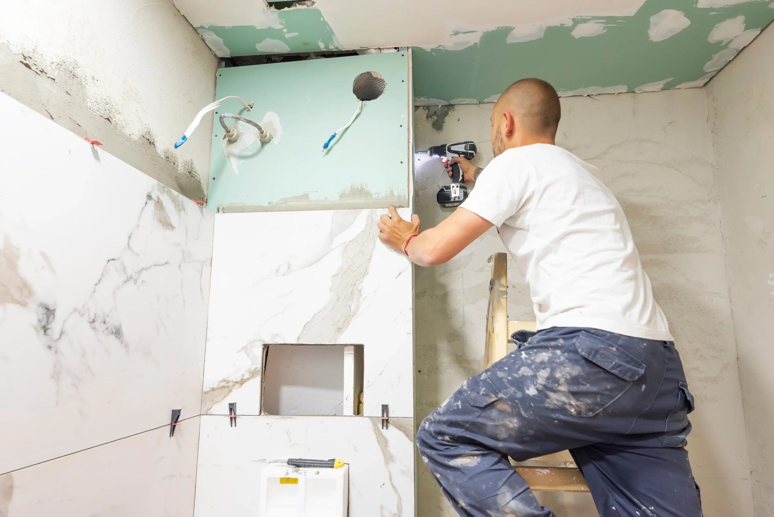 Man doing house renovations that may have an affect on capital gains tax