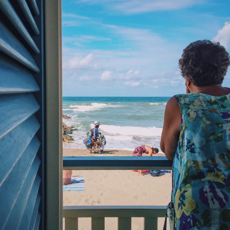 Woman enjoying beach holiday home