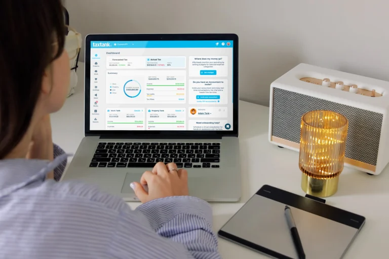 Woman working on laptop to join all bank accounts