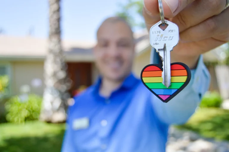 Man holding a key to his first investment property