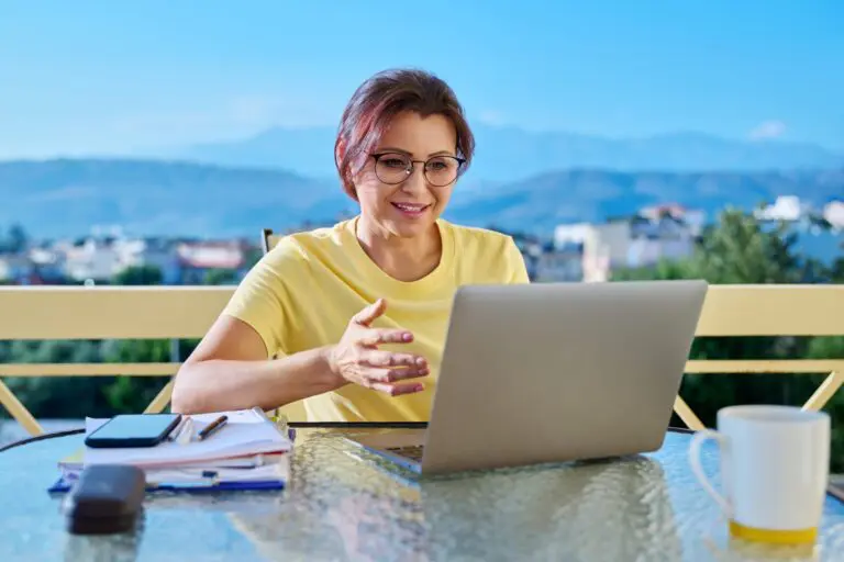 Middle aged woman in her home office doing her ABN Tax Calculation