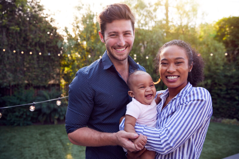 Portrait Of Family With Baby Son At Home Outdoors In Garden for life insurance blog