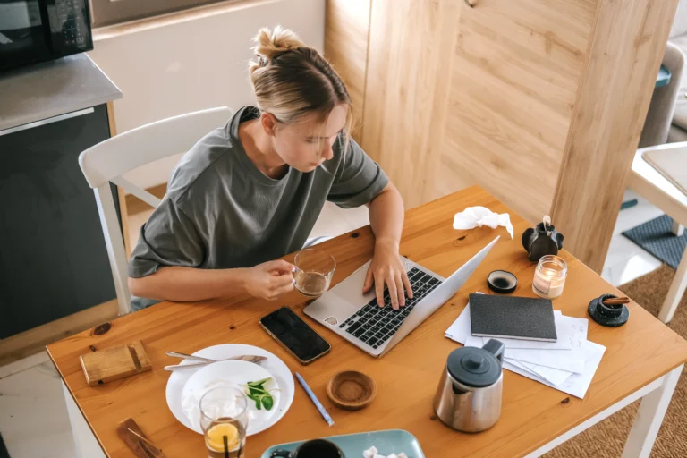 Woman working at laptop using sole trader tax software